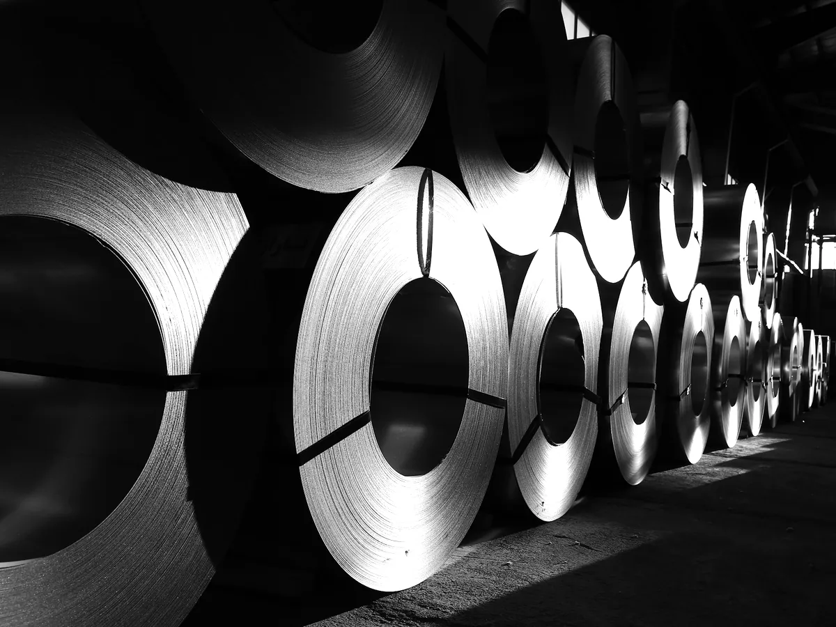 Coils of rolled steel stock in a warehouse