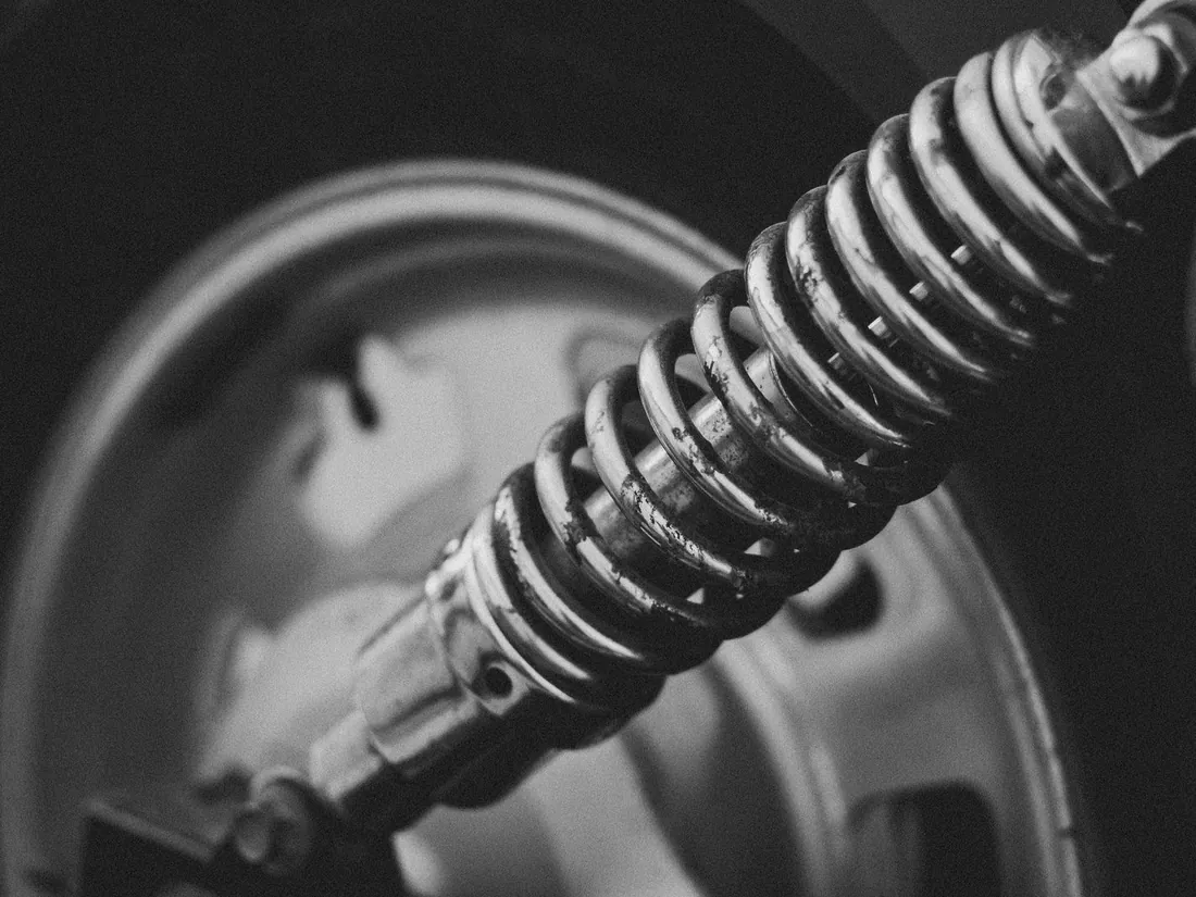 A coil spring on a shock absorber unit