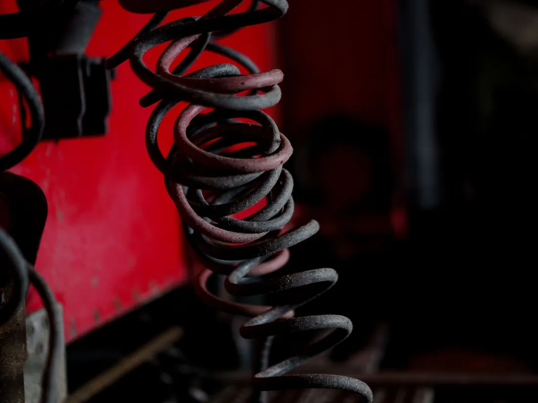 Heavy coiled springs fitted to industrial machinery