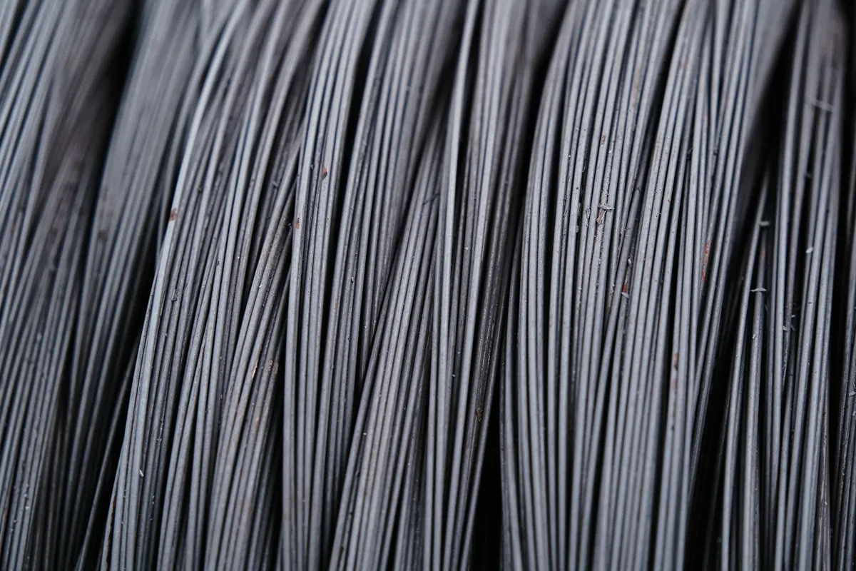 A close-up of tightly wound drawn steel wire