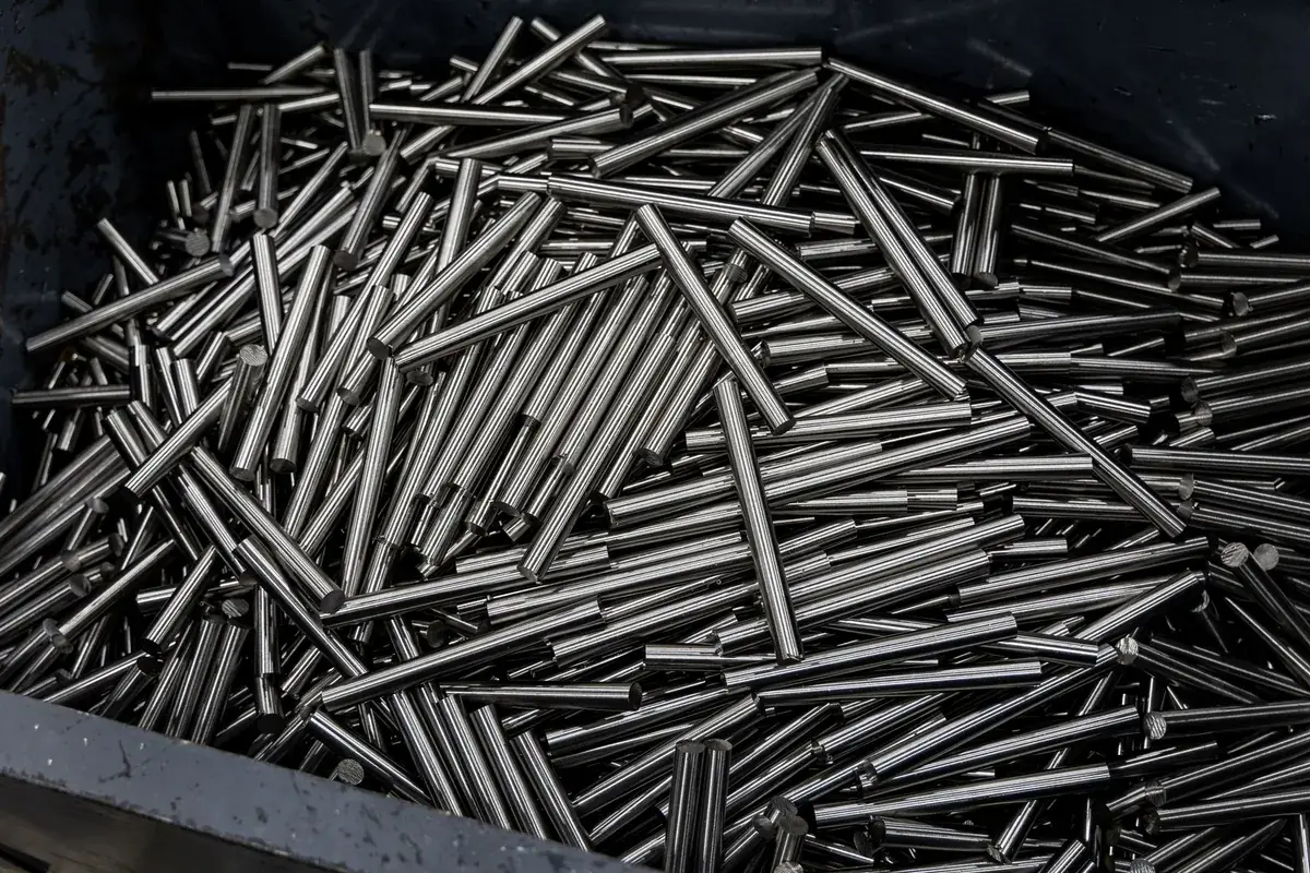 Bright stainless steel rod stock in a bin