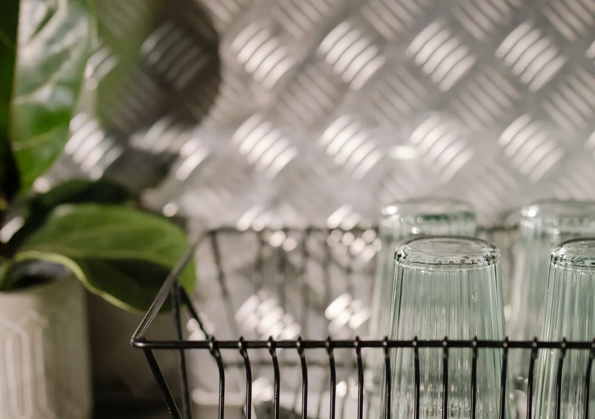 A steel wire glass rack in a kitchen