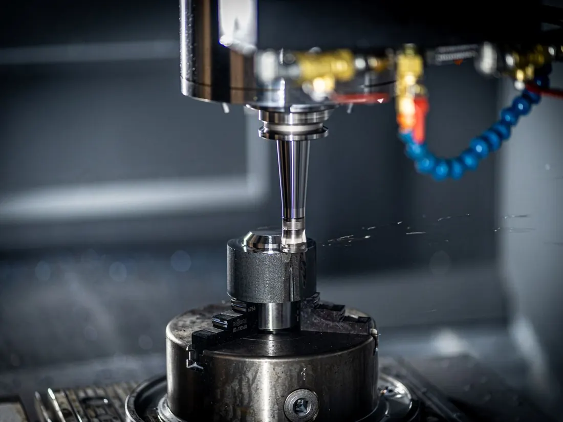 A CNC machine cutting a metal part