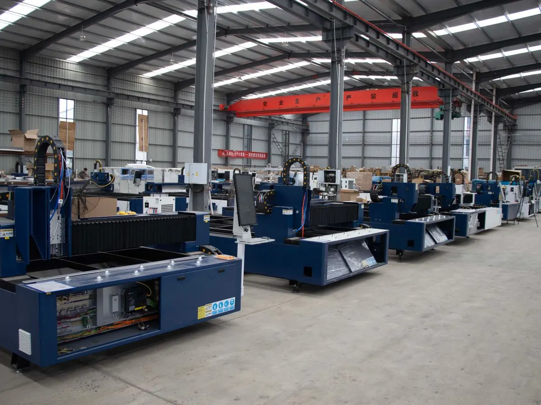 A row of CNC machines in a production hall